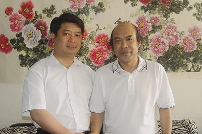 与著名牡丹画家罗玉祥先生在一起.JPG